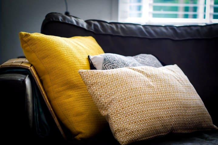 pillows on couch for a low cost room makeover