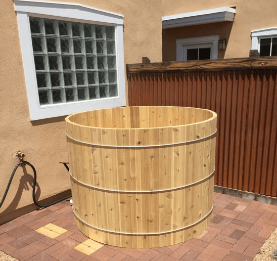 A fully assembled cedar hot tub