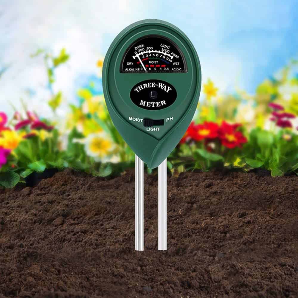 a three-way soil tester in the dirt