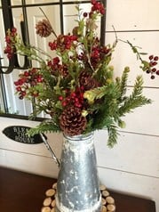 This foraged winter bouquet features evergreen branches and pinecones