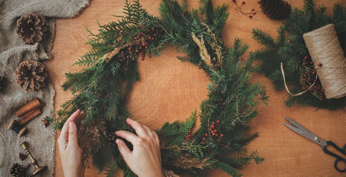 Rustic holiday decor includes a homemade evergreen wreath