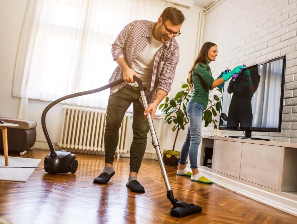 man and woman use quick house cleaning tips