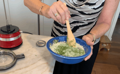 stirring the cheese into the basil blend