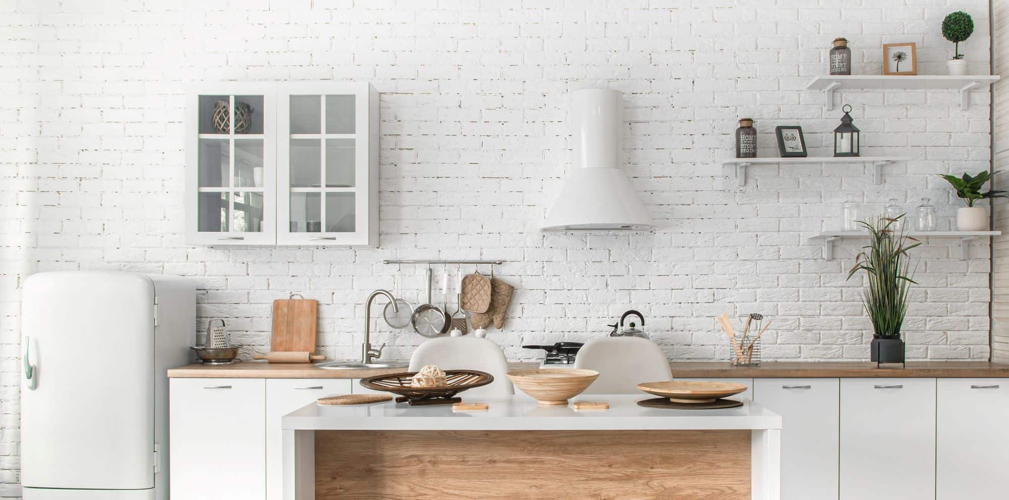 rustic kitchen with brick wall painted white
