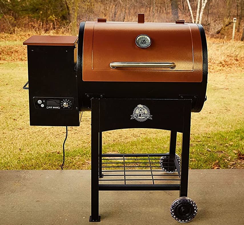 A Pit Boss brand pellet grill sits on an outdoor patio