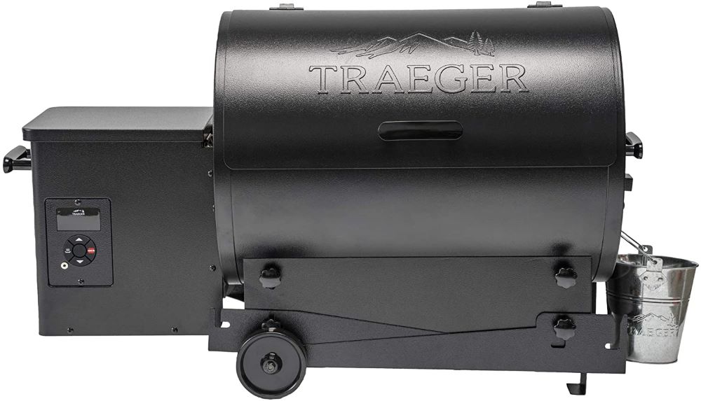 a traeger portable grill with the legs folded down.