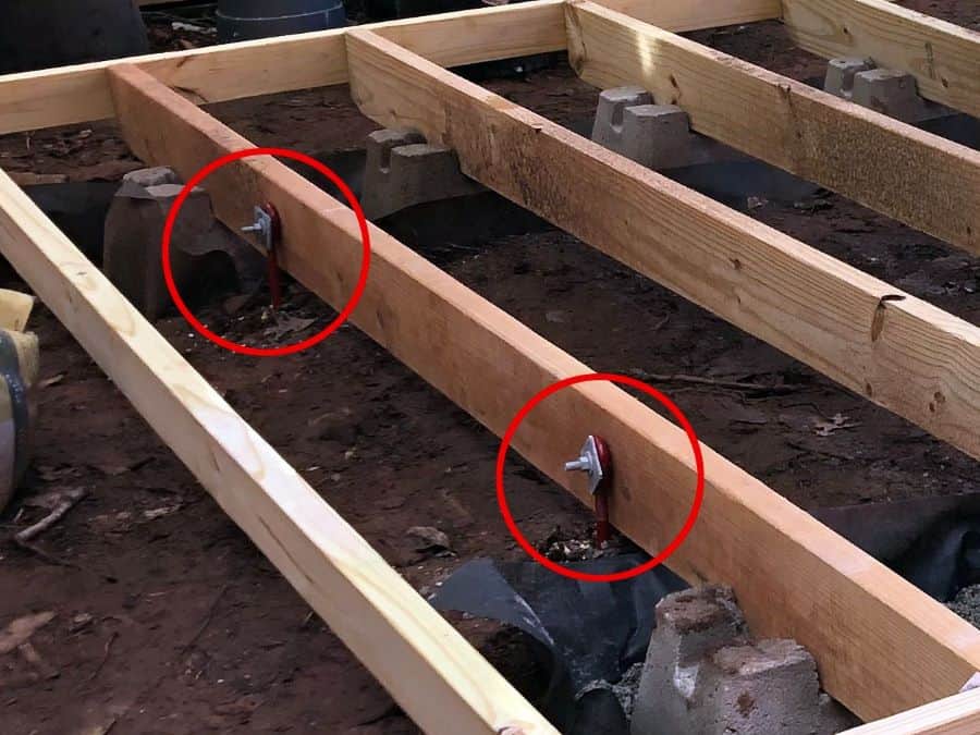 install ground anchors to deck frame