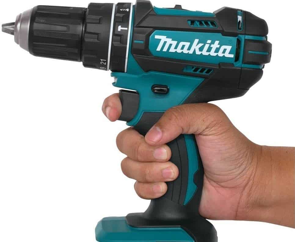 a hand holding a cordless power drill