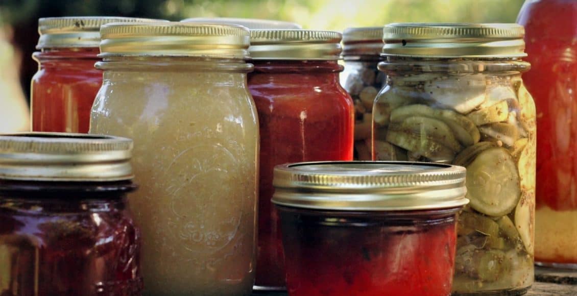 canning jars filled with preserved fruit
