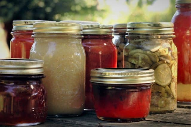 canning jars filled with preserved fruit
