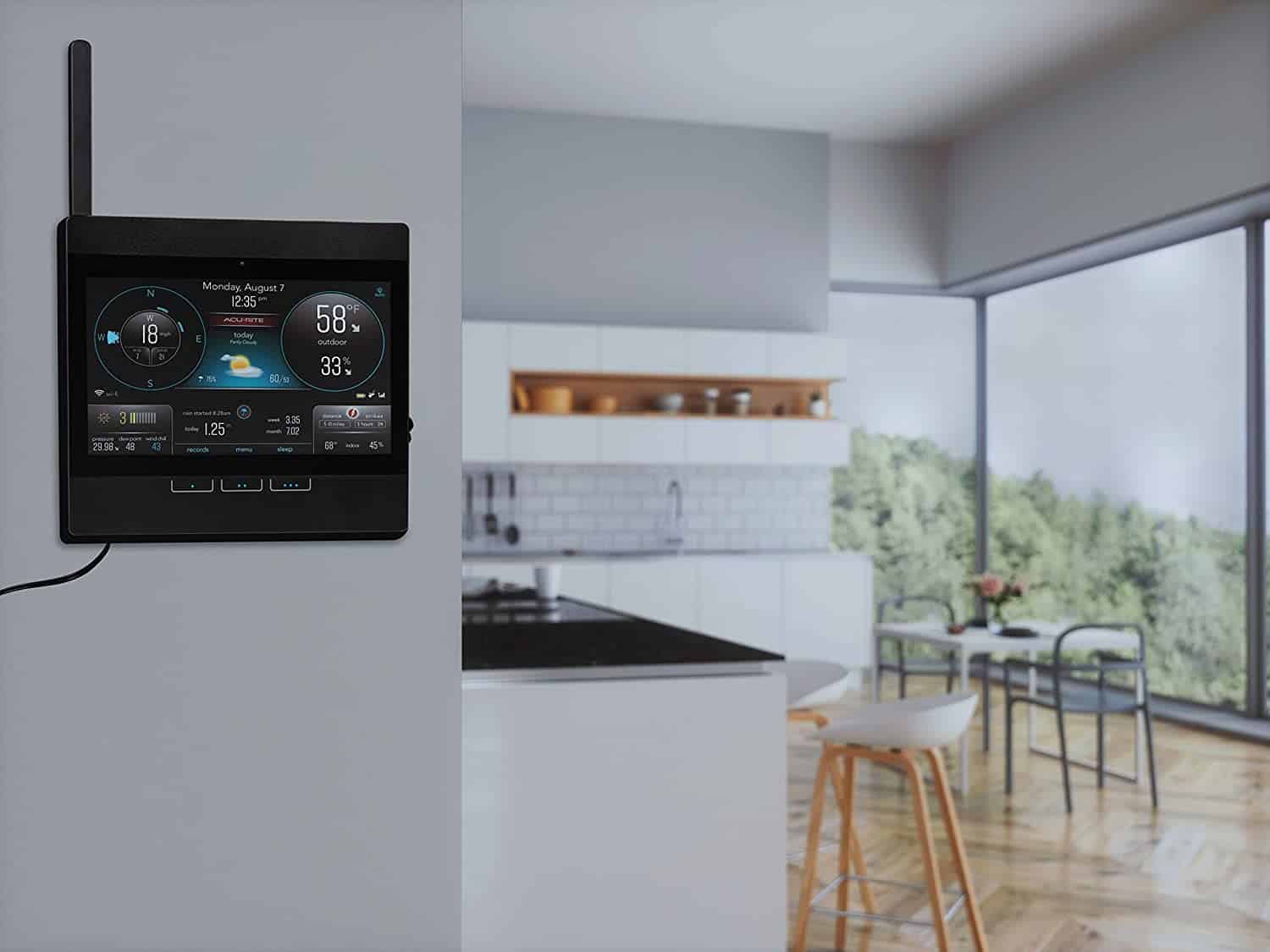 an acurite home weather station monitor mounted on a kitchen wall