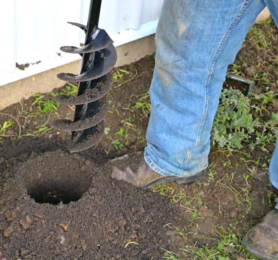 a Power Planter auger digs a hole in dirt