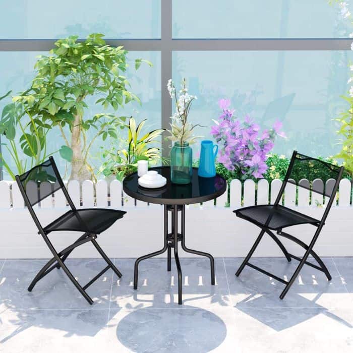 a bistro set table and two chairs for an outdoor retreat