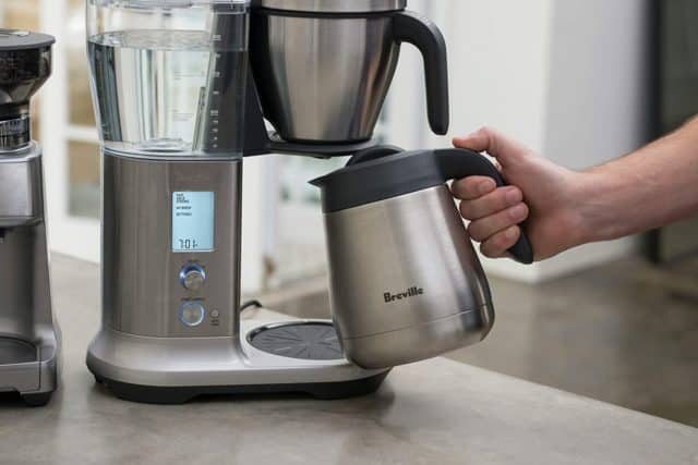 a breville coffee machine with a brushed metal carafe