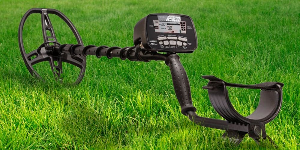 a metal detector on a lawn