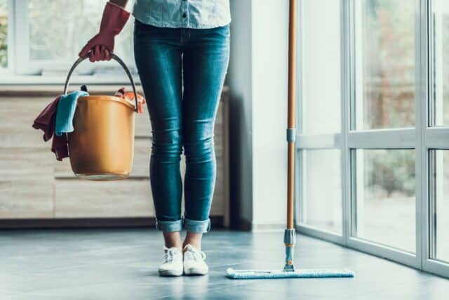 house cleaning tips woman with bucket