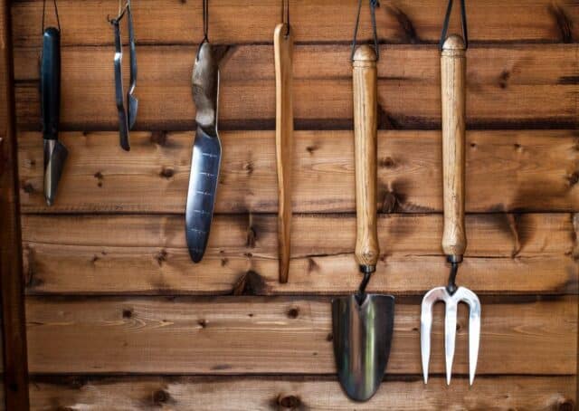 yard care tools in garden shed