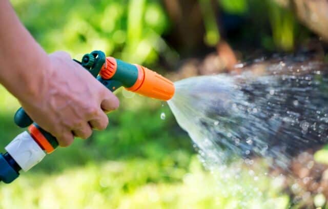 watering garden healthy soil clean water
